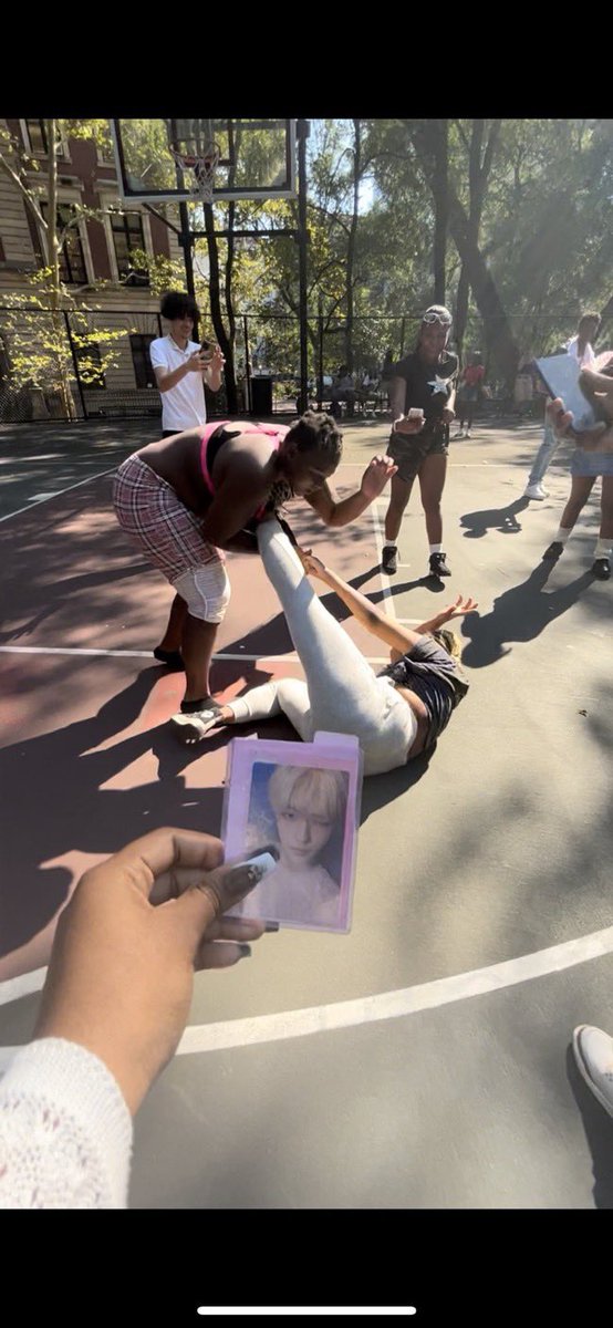 kpop stans always taking pics of their little cute photocards in any given scenario like this got me CTFU???? 😭😭😭