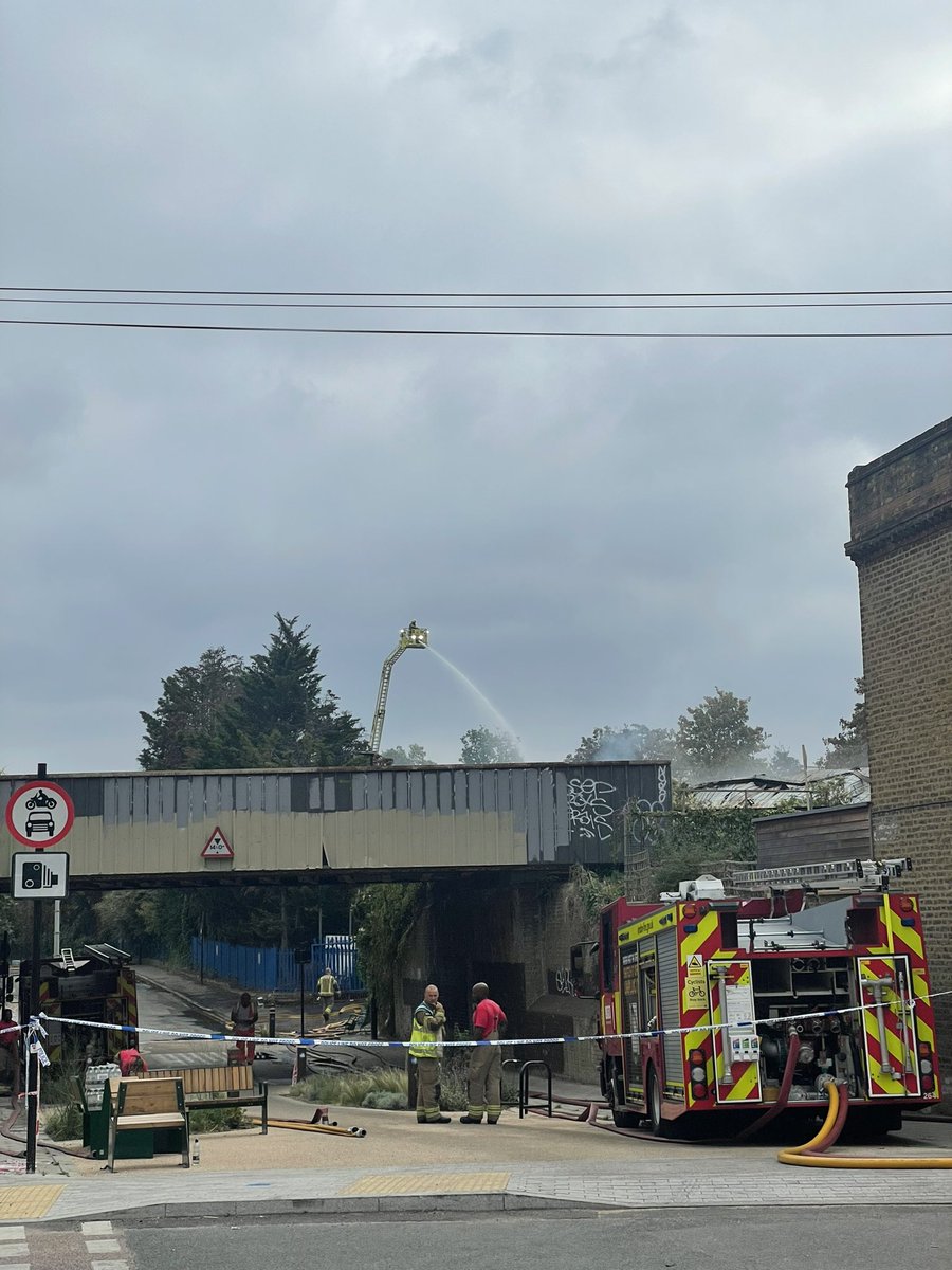 BastieVelo's tweet photo. Fire fighters up in a cherry picker to put the fire out on Shakespeare Road #hernehill #brixton #fire #urbin #recyclingcentre https://t.co/0MFuiJawfE