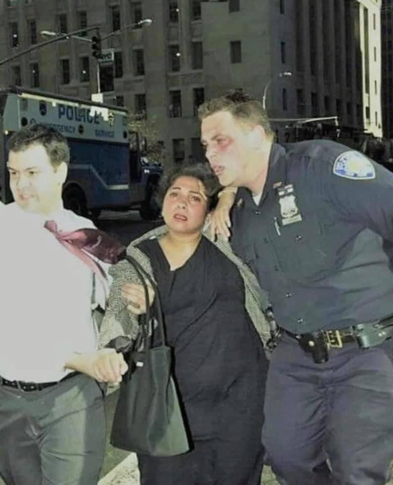 Perhaps we can make this photo go viral again. This is Officer Chris Amoroso of the NYNJ Port Authority Police. This photo is from September 11, 2001, with the towers behind him. After saving this pregnant woman Chris decided to go back in for his 5th time. Despite having a wife