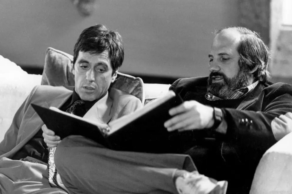 Retro_Co's tweet photo. A very happy 83rd birthday to Brian De Palma. Pictured here with Al Pacino on the set of Scarface, 1983. https://t.co/L3WBXfHaaz