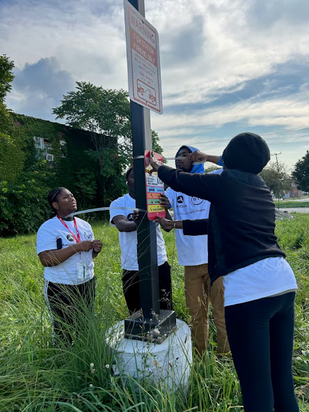 AMUSproject's tweet photo. We are spending our 9/11 day of service putting up theft prevention signs around Metro Detroit! @MCSConline #911MI https://t.co/p166tg9bA3