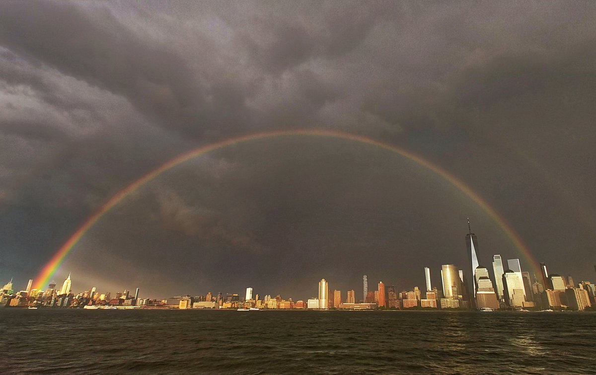 On the 22nd anniversary of the 9/11 attacks, a rainbow forms in the sky between One World Trade and the Empire State Building in New York City, Monday evening #NewYorkCity #nyc #newyork @empirestatebldg #sunset @agreatbigcity #NeverForget911