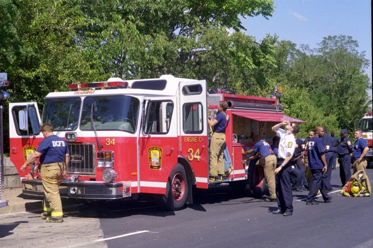 DCFDKelleher's tweet photo. The @dcfireems Training Division’s No. 34 and No. 35 Engine on the scene at the Pentagon on #September11th2001. Photos courtesy of AJ Illenotna. #DCFD #DCFDHistory https://t.co/dAmz6oVxnf