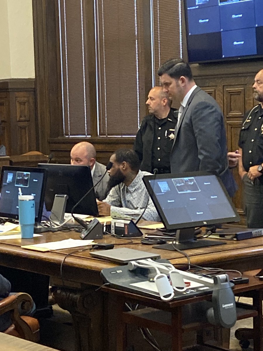 Darrell Buchanan of Canton (center) will soon go on trial in Summit County court for the shooting death of an Akron man. Opening statements will begin shortly. This is one of four murder trials happening in the court this week.