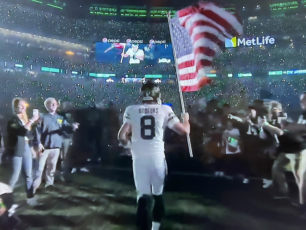 Holy wow, what a symbolic shot of this moment for Monday Night Football and @AaronRodgers12 as he literally tries to carry the torch and flag for the Jets this season.