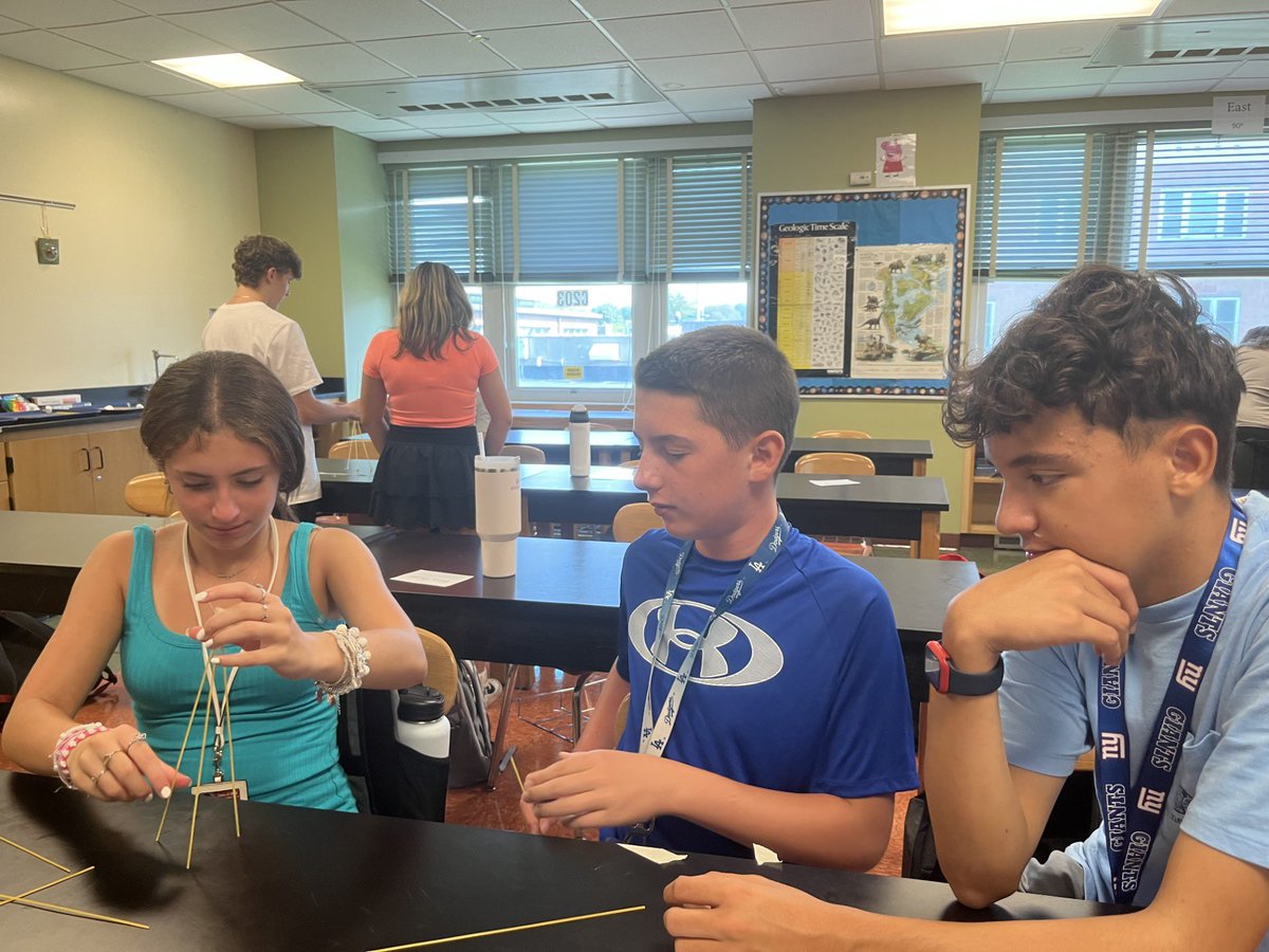Students in Mrs. Well’s Earth Science class use teamwork and problem solving to build towers with spaghetti and tape in “The Marshmallow Challenge.”