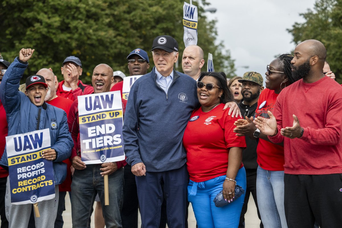 US President Joe Biden stands with striking members of the United Auto Workers (UAW) union at a picket line outside a General Motors Service Parts Operations plant in Belleville, MI. According to the White House, Biden is the first sitting president to join a picket line. @potus