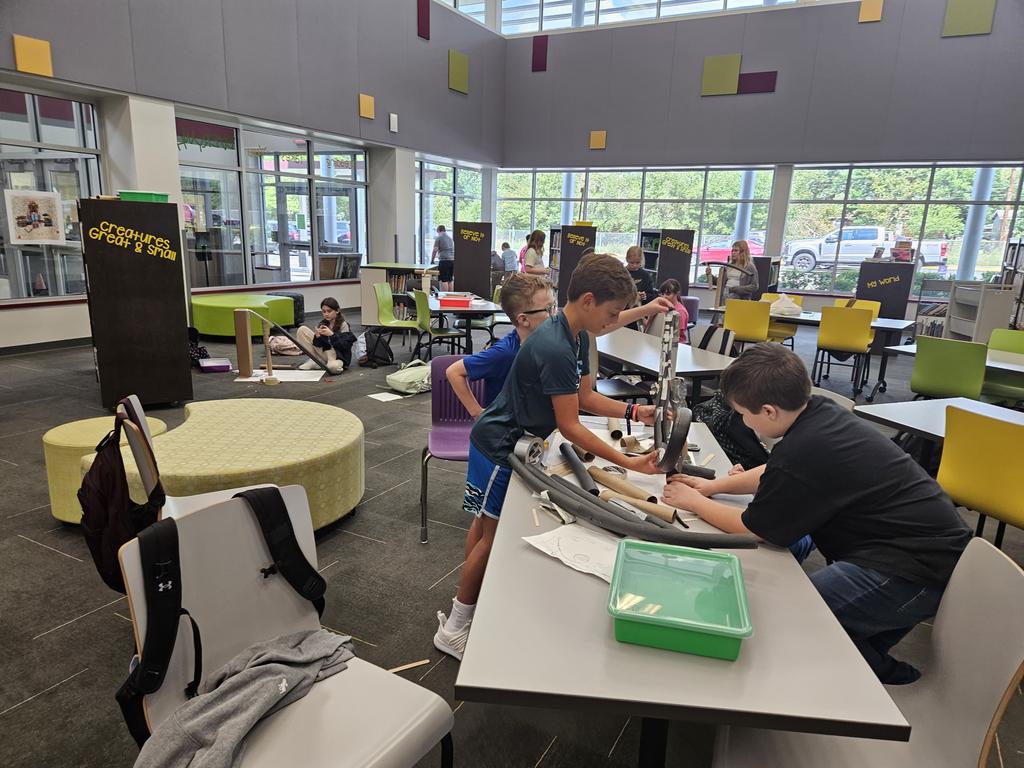 joyjstew's tweet photo. Students are busy researching the physics of roller coasters and building marble coasters with cardboard in the Magnolia Intermediate library today! https://t.co/KxHAG3U85a