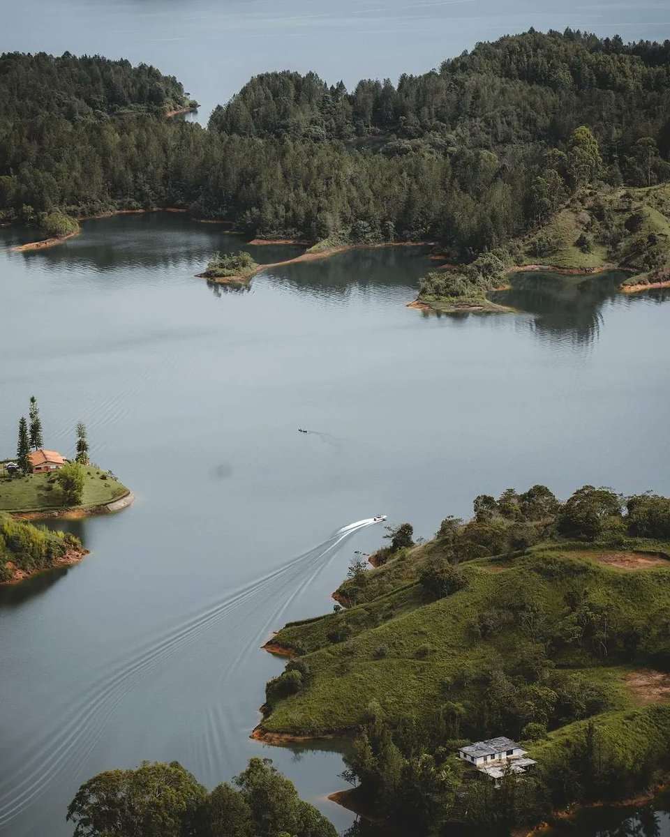 Located in the Colombian Highlands, Guatapé holds an intricate relationship with the surrounding nature. The area is famed for La Piedra Del Peñol, a giant monolith rising from the landscape, offering breathtaking panoramic views for those who conquer its 649 steps. From this