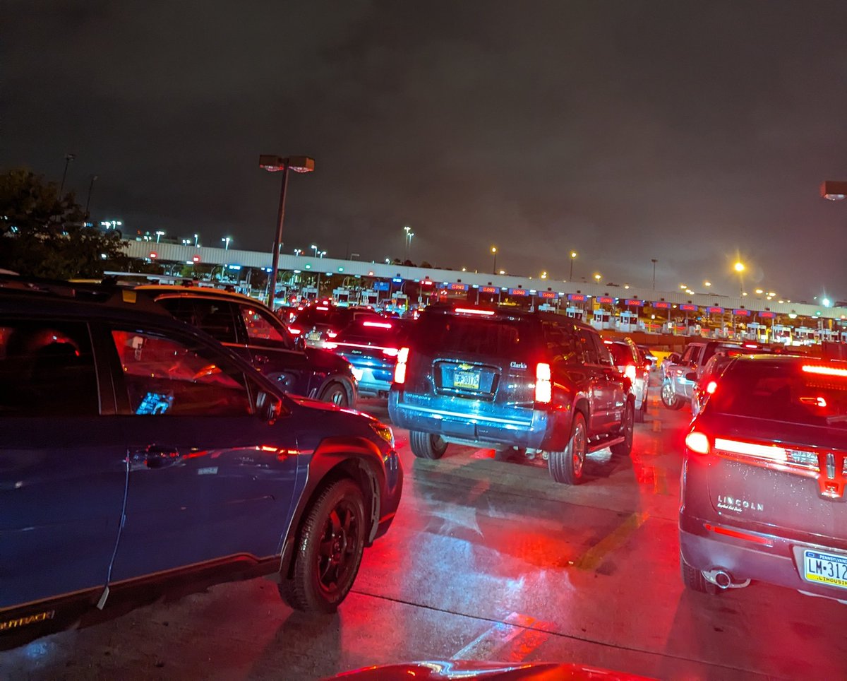 Kelli_jo_'s tweet photo. @PHLAirport having to wait 45 minutes to get out of the parking lot is wild. Miserable end to a long travel day.  Aren't these automated booths? https://t.co/CL9msub7yO