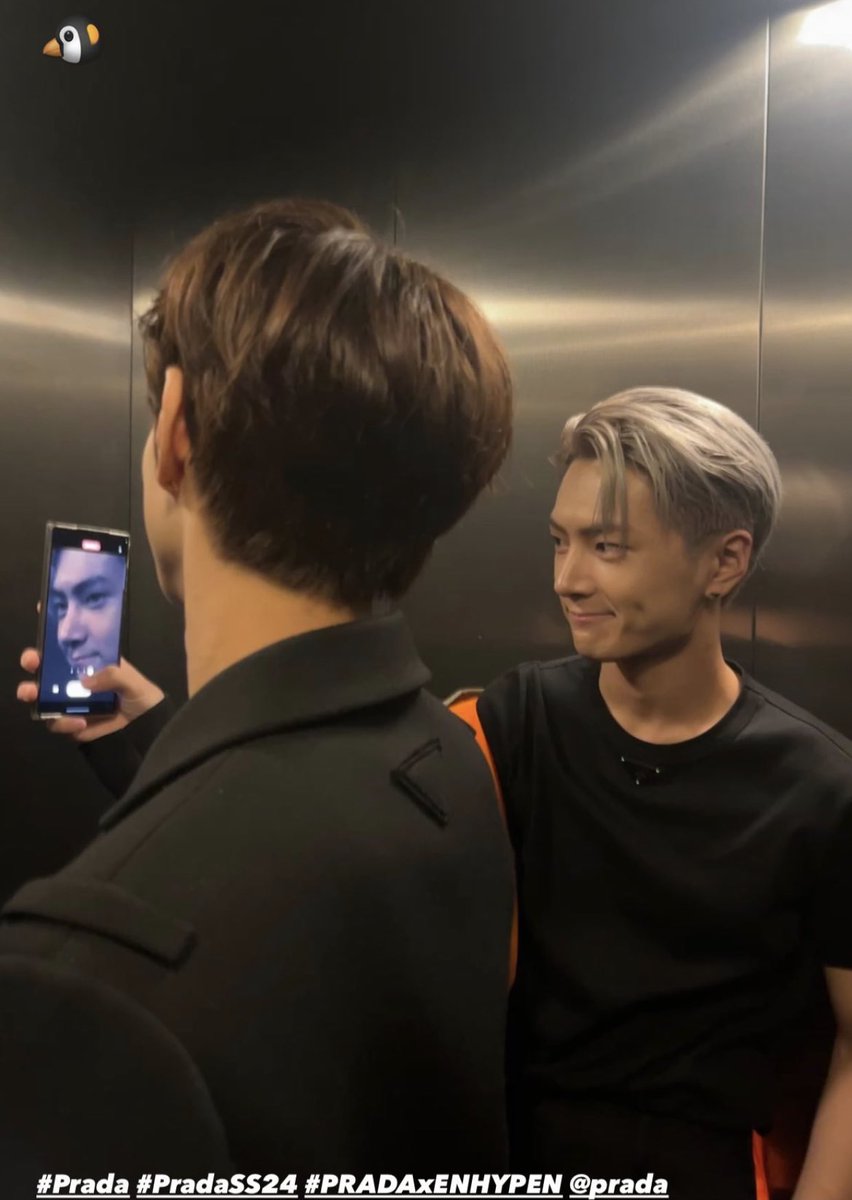 Beneath the Milanese moon's soft embrace, in the heart of high fashion's grandeur, Sunghoon's lens captured a candid moment bathed in Prada's elegance. Amidst the luminous cityscape, our souls danced to the whispers of Milan's timeless charm.