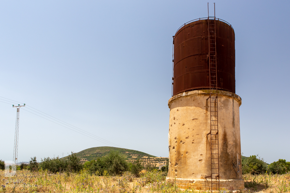 Tunisia_1943's tweet photo. 'Spang' at Jeffna railway station, opposite Green Hill, Tunisia - interestingly all on one side of the concrete base which suggests it came from the attacker's side. I didn't notice any on the metal tower so that's probably post-war #Tunisia80 @WW2TV #Spang https://t.co/KgQWtESYtG