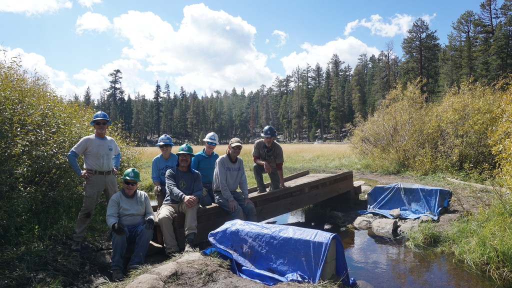 Have you been to Big Meadow? The bridge was completely underwater during early summer and sustained some damage. Thanks to these amazing volunteers, a new bridge was built to help minimize damage to the meadow. These trail heroes were up for the challenge!