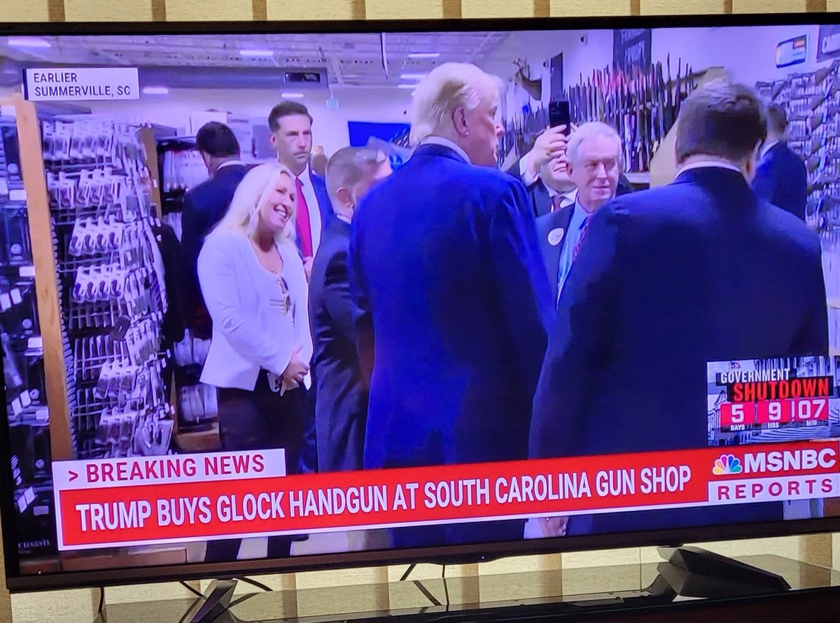 MarTheResister's tweet photo. What is wrong with this picture? EVERYTHING. 
Trump went shopping with MTG today &amp; bought a glock.  
Instead of working to avoid a Government shutdown, MTG is playing with trump. 
She don't give a fuck. She'll get paid regardless. I hate these people. https://t.co/T75SZYVh4O
