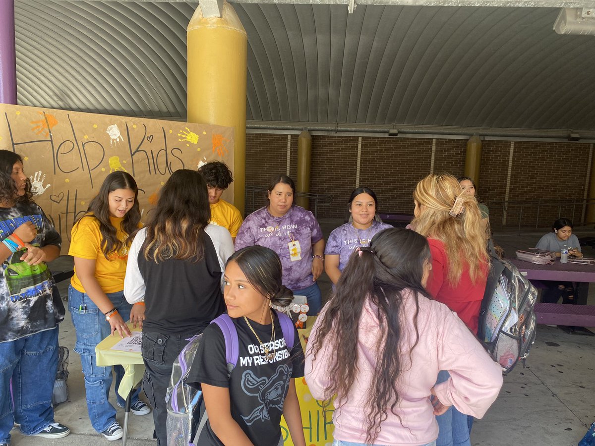 TOKC1's tweet photo. 🧡☝️TOKC #DoThatOneThing! Members from Roy Miller High School drew quite a crowd by volunteering their lunch hour to help to raise funds AND awareness for kids with cancer by selling this year’s #ChildhoodCancerAwarenessMonth shirts and other awesome #TOKCswag items…#GoBucs!💜 https://t.co/RqcLpWNAXR