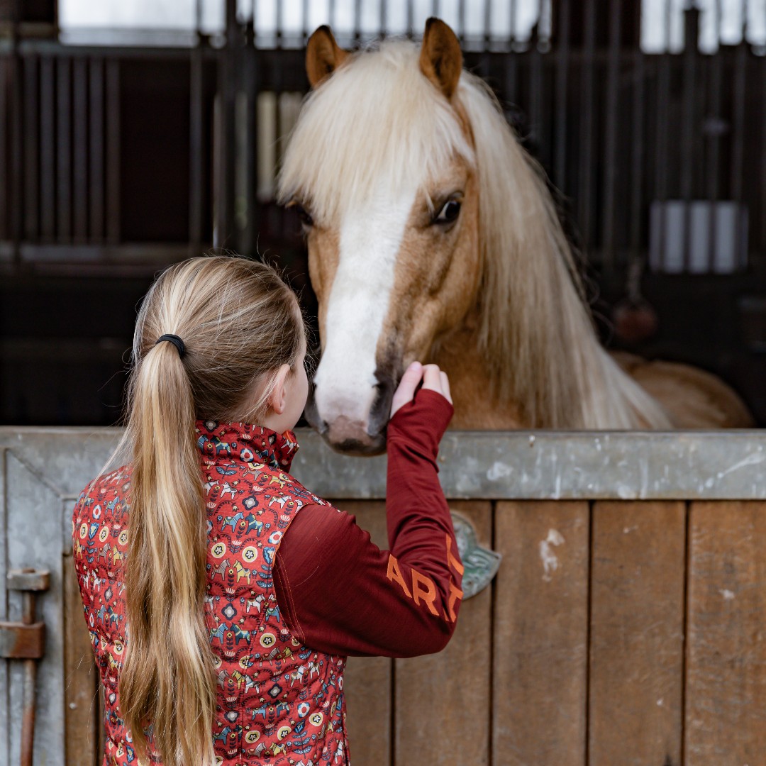 Keep your young rider’s core warm with the Bella reversible vest and Tek team sweatshirt.