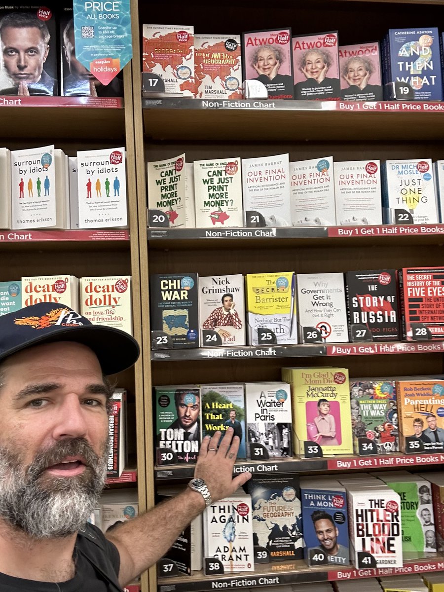 robdelaney's tweet photo. I just #caressed every copy of A HEART THAT WORKS at the Victoria Station @WHSmith. Go grab one! https://t.co/wGaSyAfzds https://t.co/OyYCGqxBFR