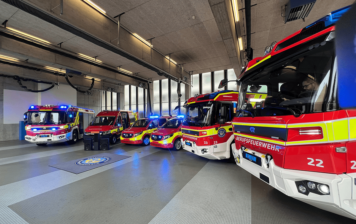 a group of fire trucks in a garage
