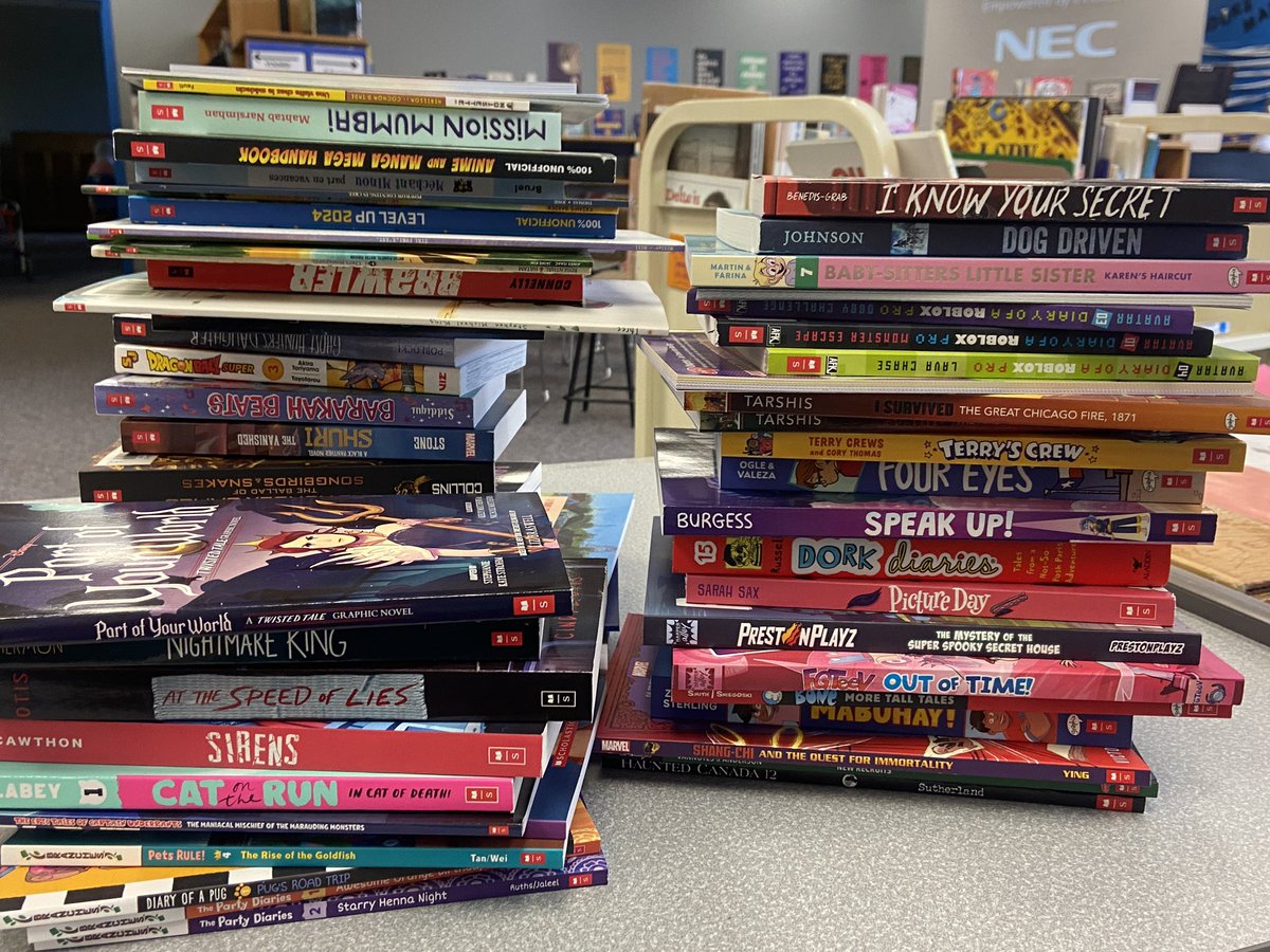 MsVsLibrary's tweet photo. So many new books from the @scholasticbookfairs to get ready for circulation at Queen Elizabeth! #schoollibraryjoy https://t.co/7ej2exp9eV