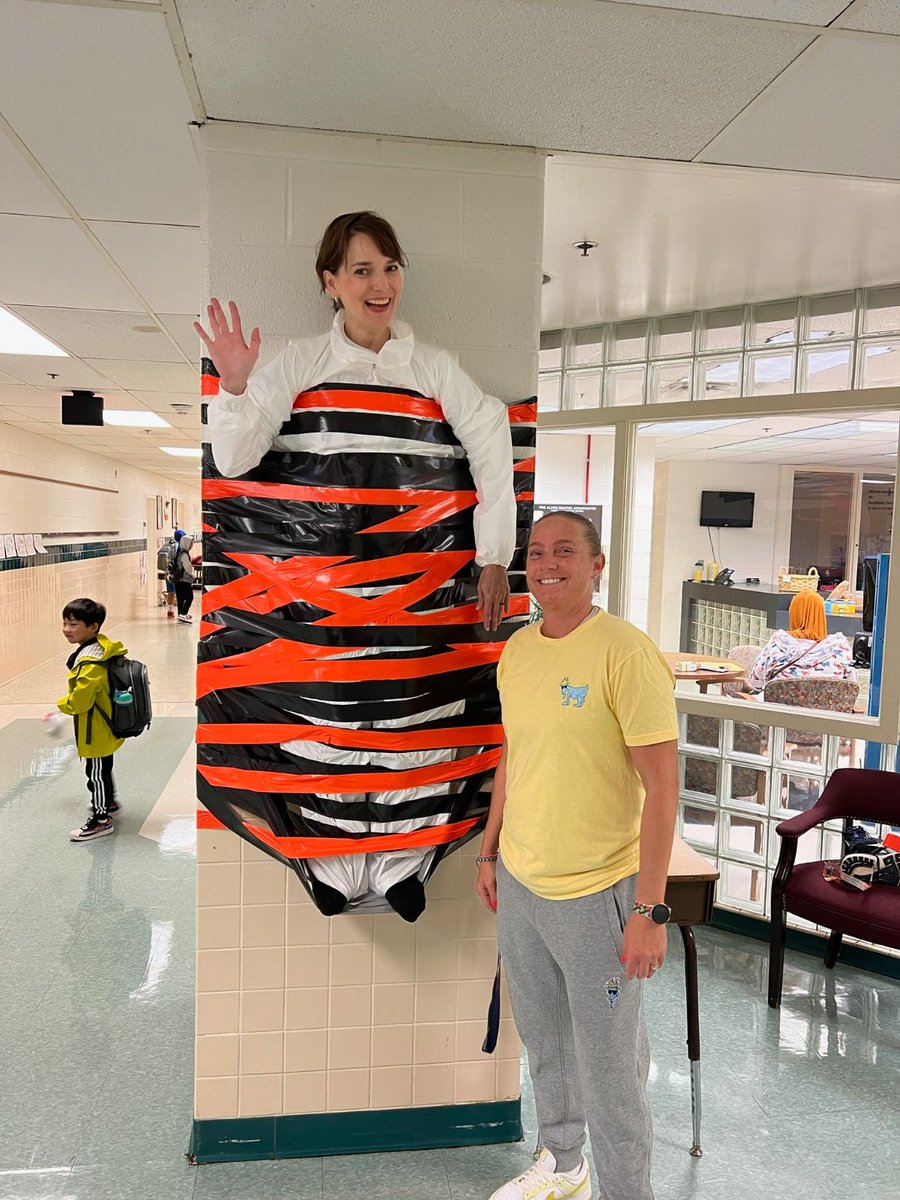 FairhillPTA's tweet photo. We're almost to the finish line! 🐯🏃‍♀️🏃‍♂️ Students were greeted to a silly surprise  to celebrate reaching $20K in Fun Run donations -- Mrs. Howard was taped to the wall🥳

There is still time to donate: https://t.co/j4RZfxkv1T

#WeBelongatFairhill https://t.co/h5MxlCqJlY