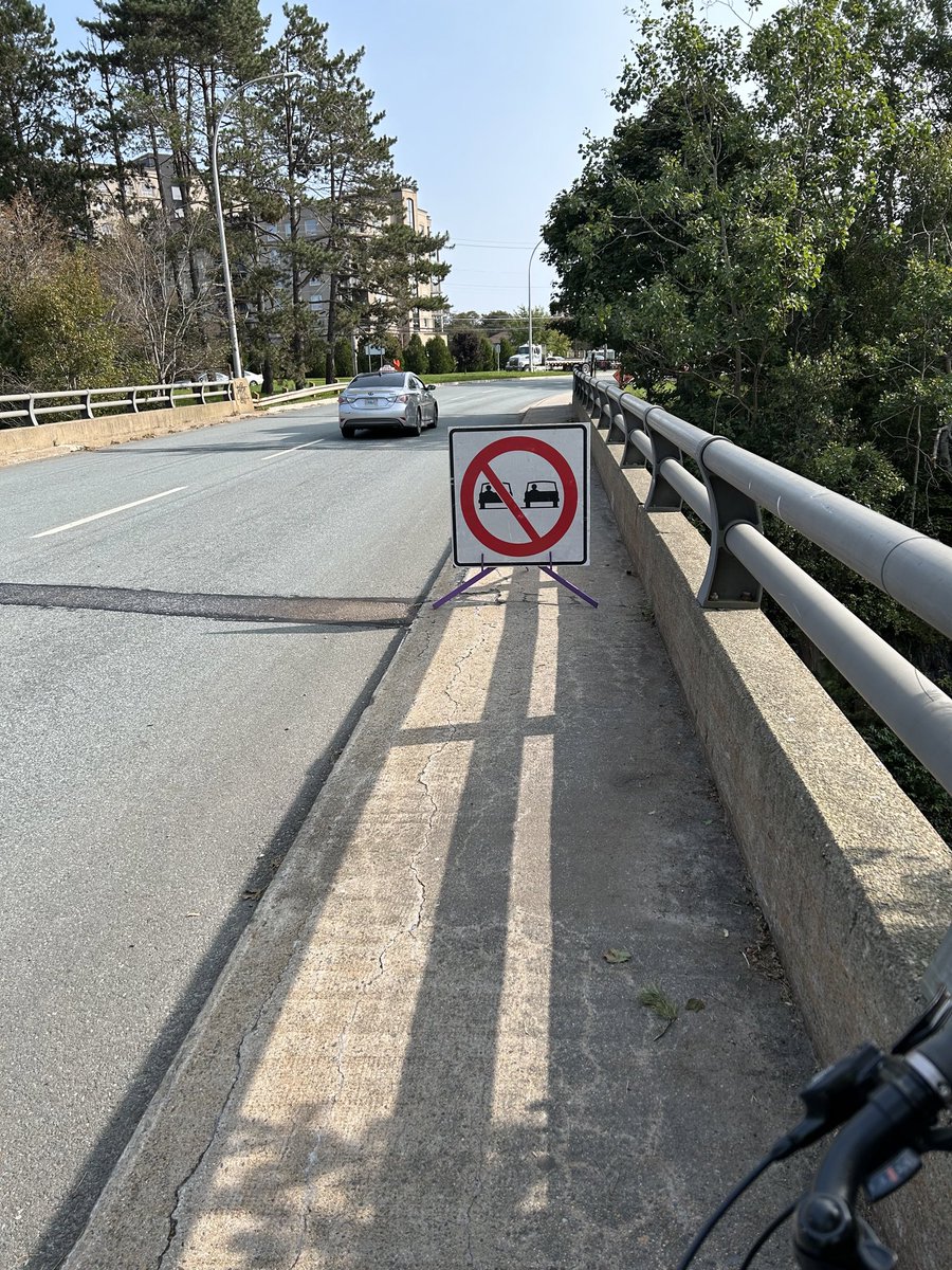 ackerverney's tweet photo. #HFXBike this may not be new, but it is to me. Sidewalk over train bridge on bears road closed https://t.co/7ekoAKKfDI