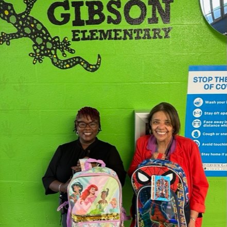 RGSDSchools's tweet photo. Dr. Crystal Henderson, principal of Gibson Elementary, &amp; Dr. Jesolyn Larry, the director of Technology, pose with book bags &amp; school supplies donated from Ricoh. The Technology Department delivered the donated supplies to scholars at Gibson, Koch &amp; Lewis &amp; Clark. Thanks Ricoh! https://t.co/Ni8PiLEVSo