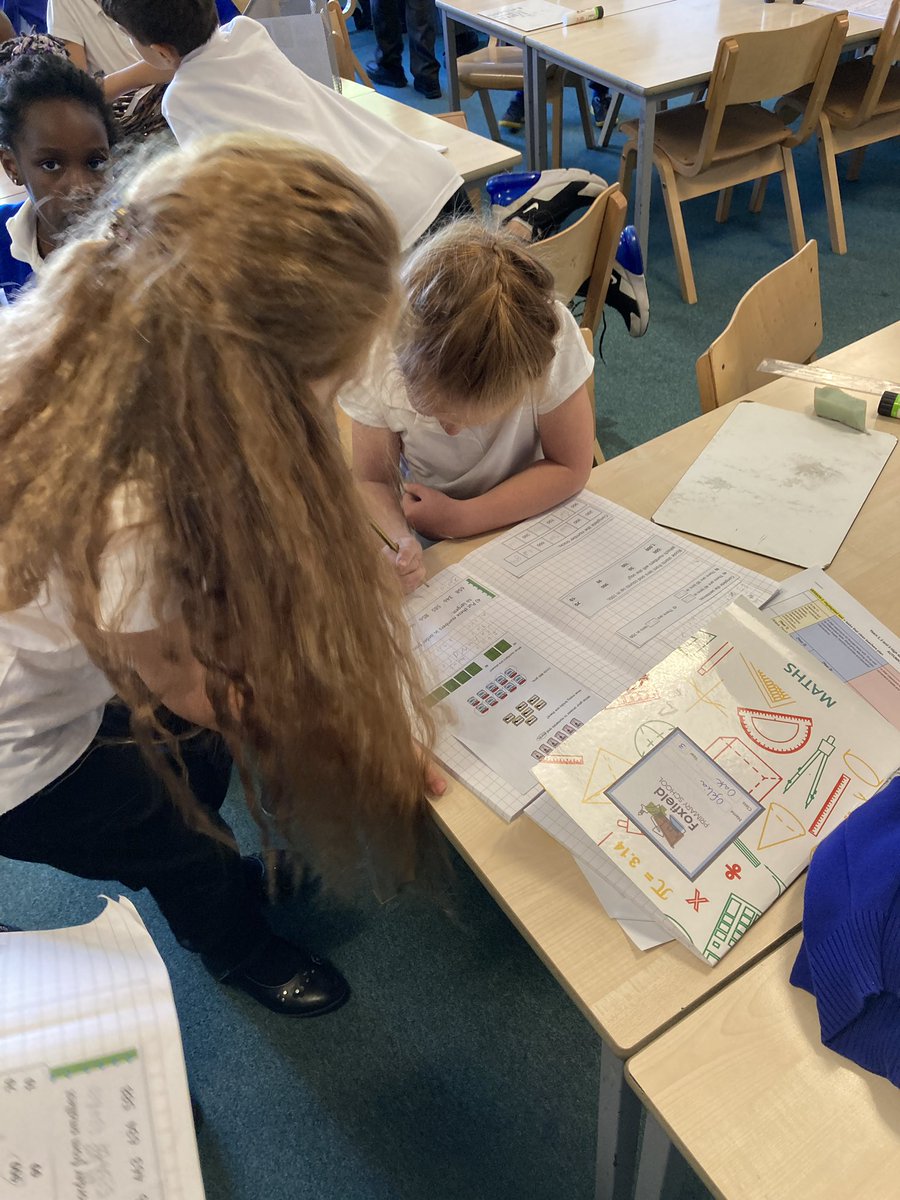 FoxfldOak3's tweet photo. In maths we have been learning to identify 3 digit numbers in our topic of place value. Members of the class became coaches in supporting others in their learning. @MrGoldFoxfield modelled the learning expectations through his model maths book. @foxfield @IPAT_Edu @FoxfieldMaths https://t.co/at4S6gVZJd