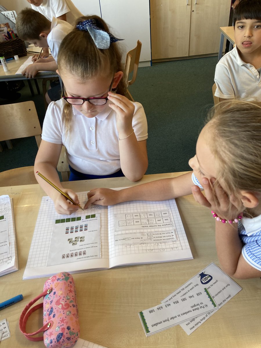 FoxfldOak3's tweet photo. In maths we have been learning to identify 3 digit numbers in our topic of place value. Members of the class became coaches in supporting others in their learning. @MrGoldFoxfield modelled the learning expectations through his model maths book. @foxfield @IPAT_Edu @FoxfieldMaths https://t.co/at4S6gVZJd