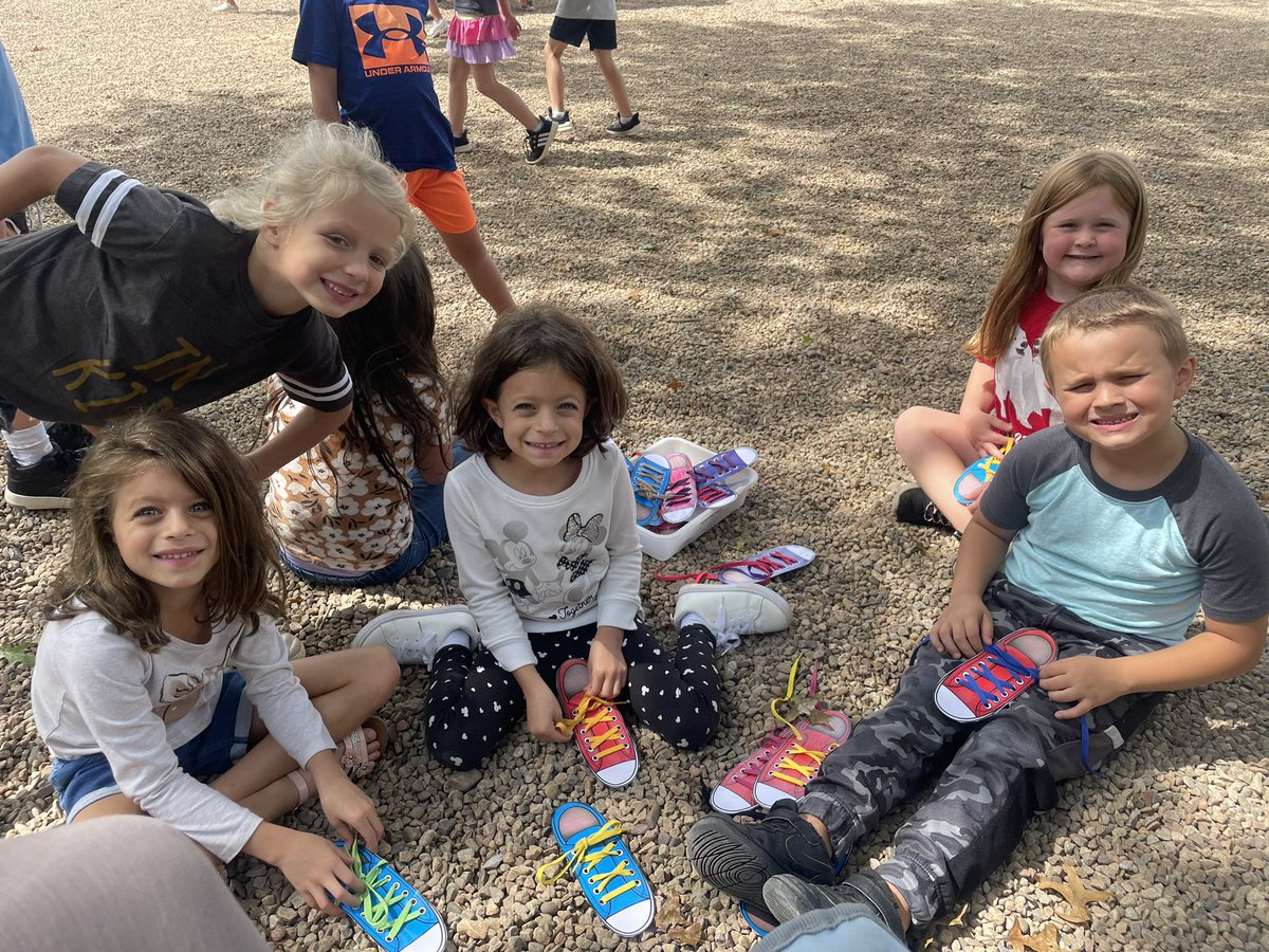 Tying shoes on the playground!