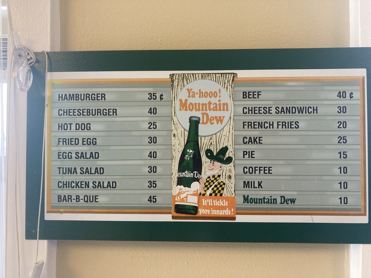 GGGenge's tweet photo. How old do you think this sign is? A 40 cent cheeseburger!?
#vintage
#mountaindew
#tinsign https://t.co/wbxubo1xMK
