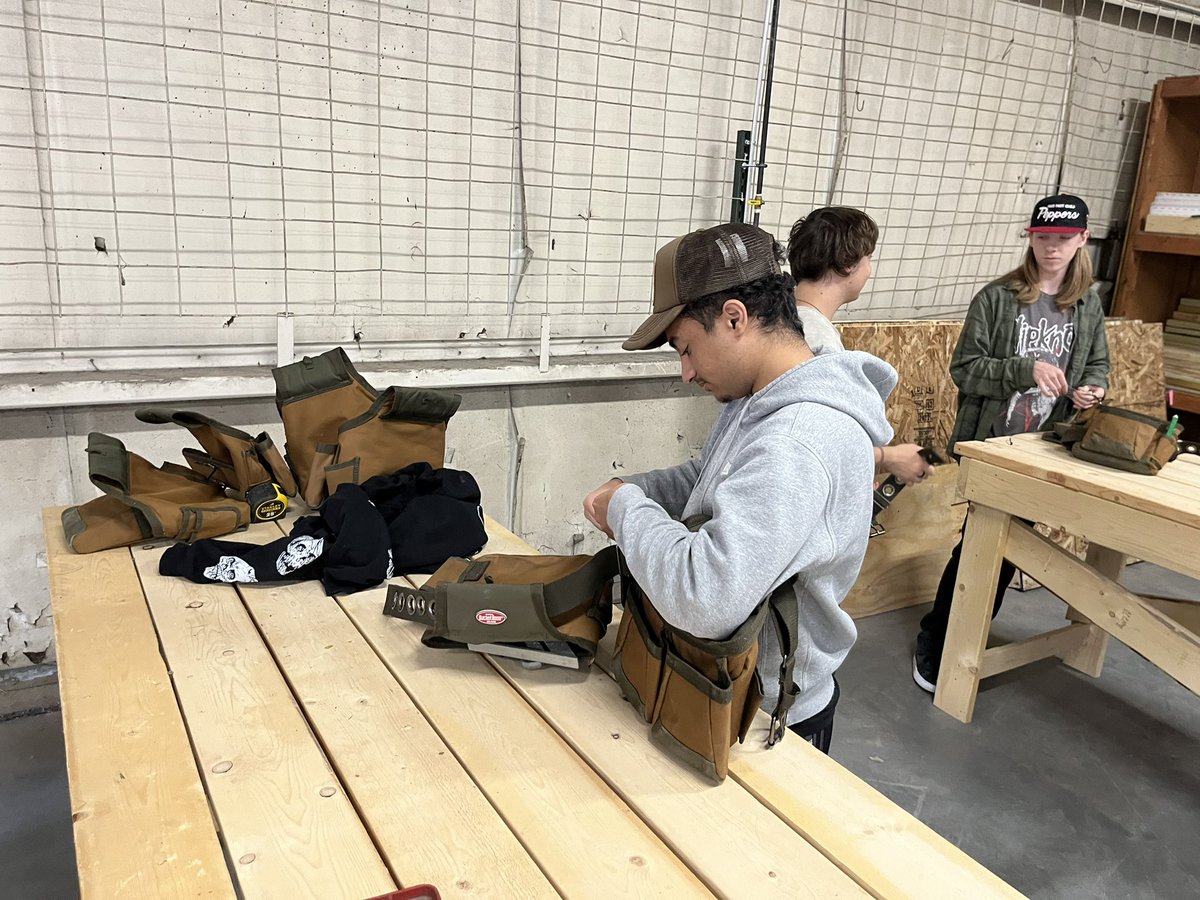 Day two at Plumb Tech Inc. workspace strapping belts on and learning how to read blueprints for wall framing a garage project next week on a new work site.