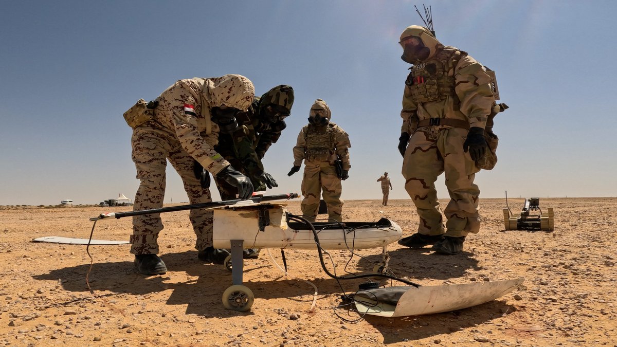 An Egyptian Army soldier, a Jordanian Armed Forces soldier and U.S. soldiers work together to inspect a downed unmanned aerial system for chemical, biological, radiological, nuclear, and explosive (CBRNE) contamination during #BrightStar23 #PeoplePartnersInnovation