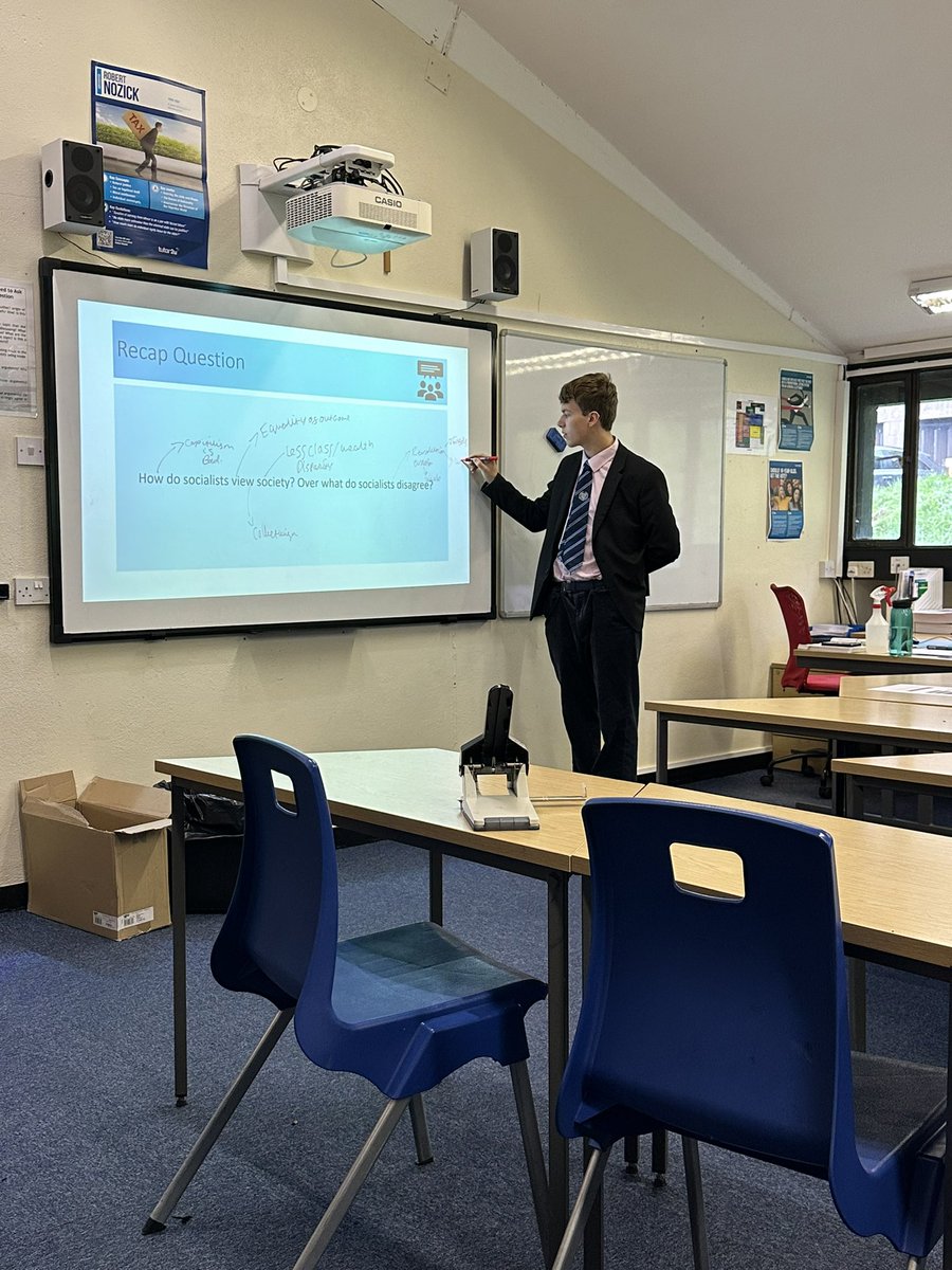 AmpColl_GovPol's tweet photo. Benedictine scholarship is about community in the classroom. Here is some collaborative work in Mr Strange’s Year 13 lesson- a recap task “taught” by Crispin to his peers! https://t.co/AN2XkG0AGc