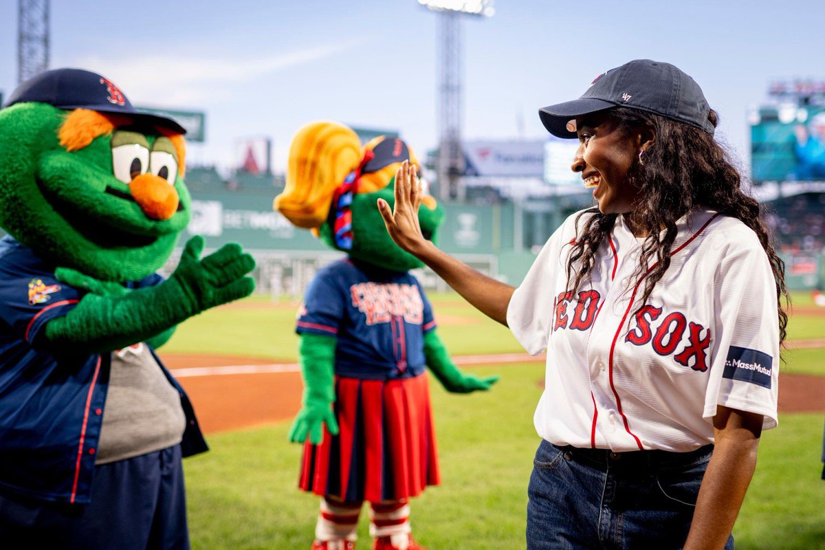 Ayo looks engrossed in conversation with Red Sox mascots, Wally & Tessie at the Yankees Vs Red Sox game last night.