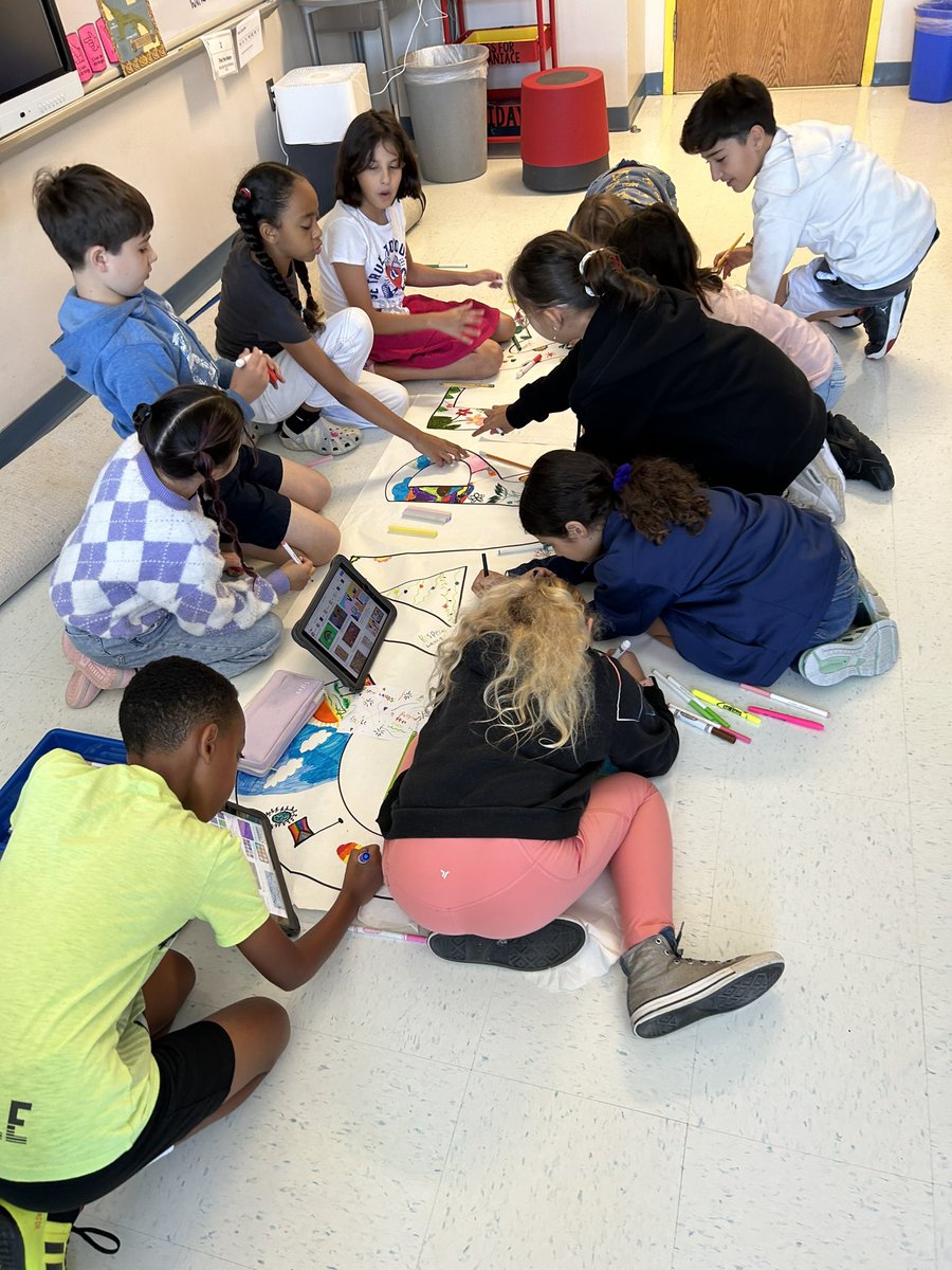 5th graders work on their first Innovate for Impact project. Making a banner to encourage CARES. <a href="/Innovation_APS/">Innovation Elementary</a> <a href="/MrsPeters_APS/">Claire Peters</a> @Mrs_White_APS