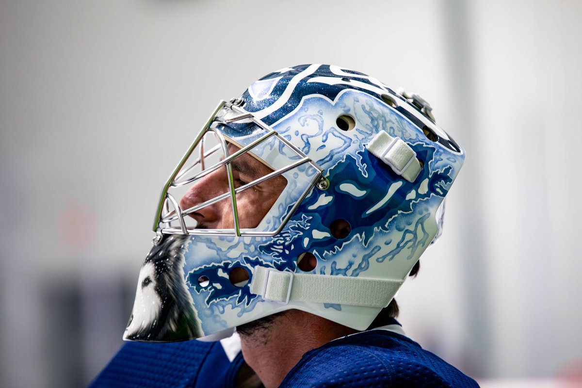 NHLJets's tweet photo. He’s got that dawg (on) him 🐶 

Front and centre spot for Tinley on Helle’s new mask!

🎨: @Eyecandyair https://t.co/dV7LvdzmbD