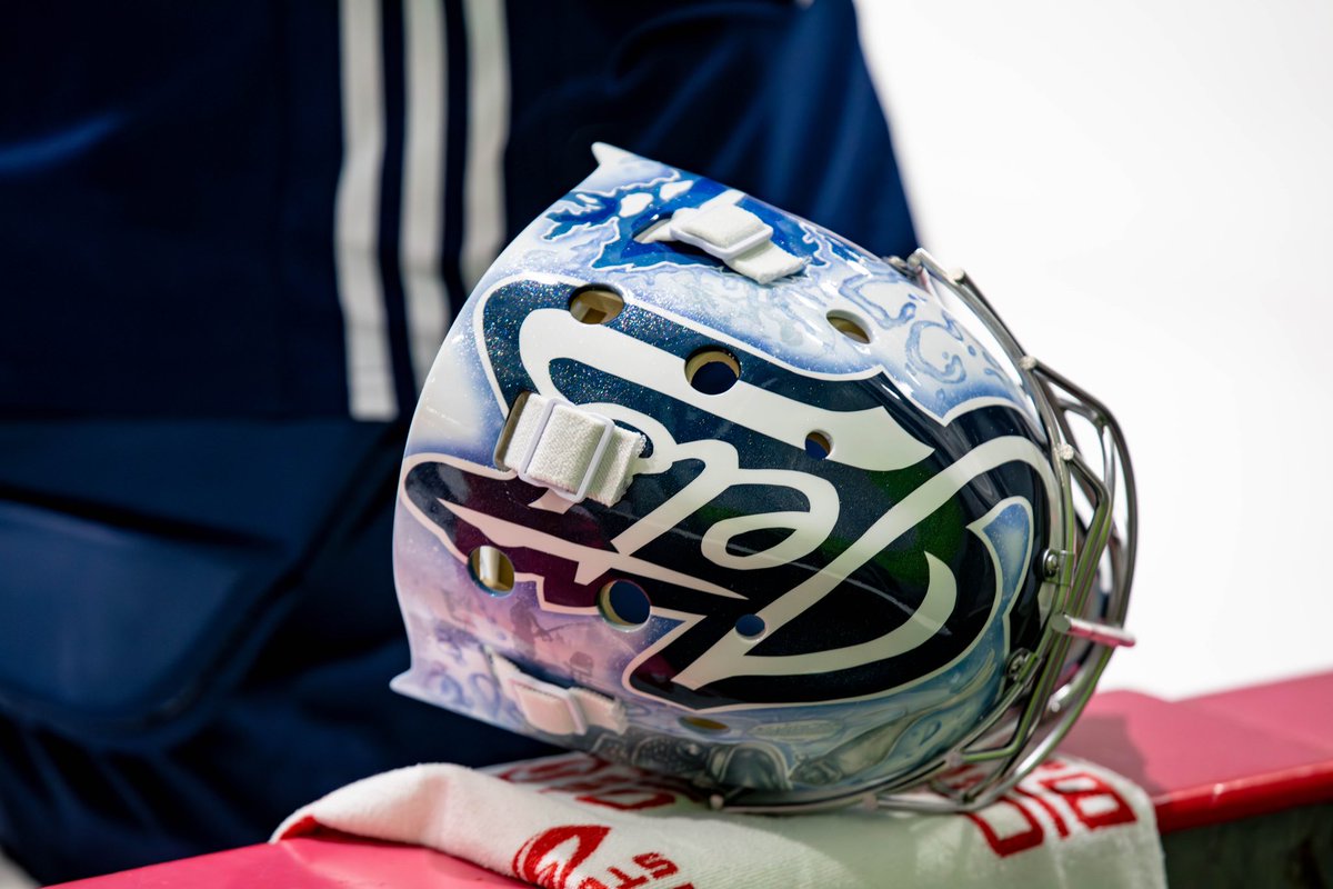 NHLJets's tweet photo. He’s got that dawg (on) him 🐶 

Front and centre spot for Tinley on Helle’s new mask!

🎨: @Eyecandyair https://t.co/dV7LvdzmbD