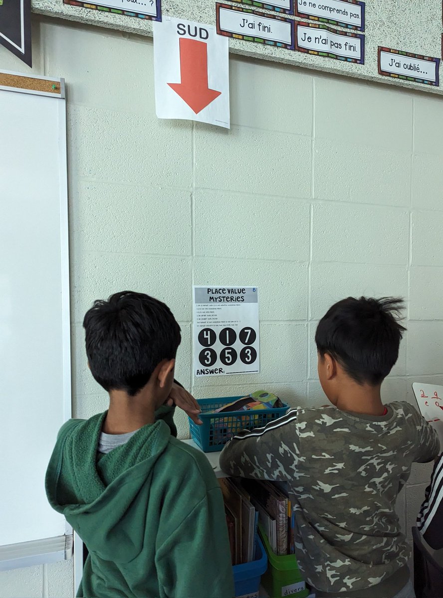 HeyMrsShea_'s tweet photo. Some Fun Friday math! We are reviewing place value by playing some "mystery number" games where we used clues to figure out which number is in which place. Lots of great teamwork and respectful math discussion! https://t.co/MzleX43SbI