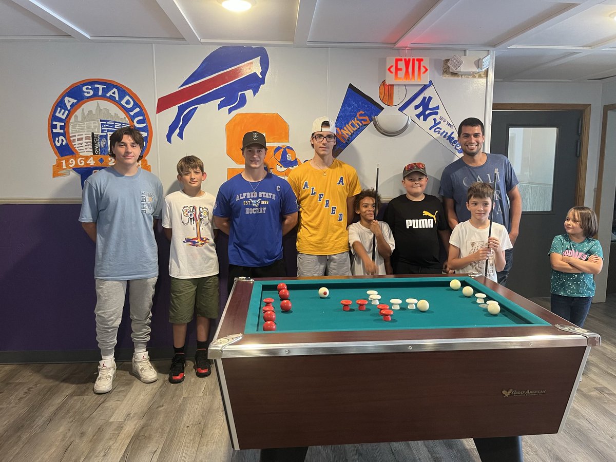 ASC_Hockey's tweet photo. Forwards Bryan Schuman, Austin Walker and defenseman Dom Visconte helped deliver a bumper pool table to a local youth center in Hornell this week https://t.co/qbr2UposNW