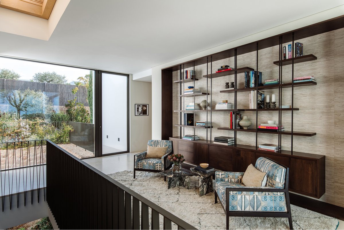 One of my favourite parts of designing a home is creating a library. Here we created a floating credenza and shelving inspired by 1960’s design, The Branco e Preto jacaranda-wood chairs and vintage marble side tables.