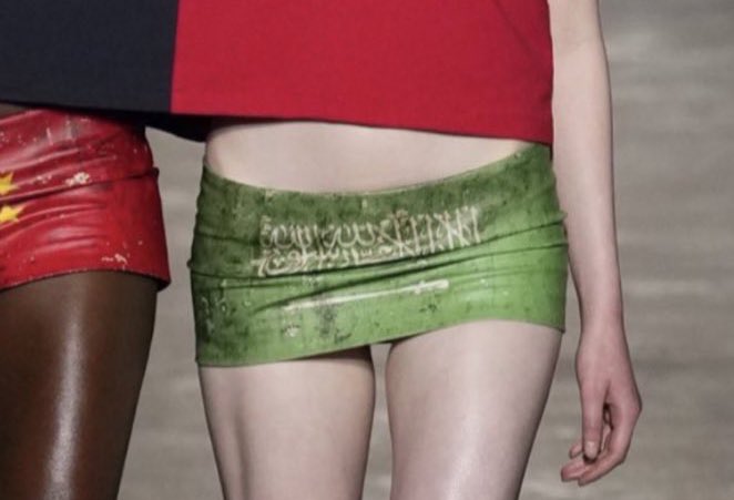 Mowalola ss24 features a mini skirt with the Saudi flag on it. For those who don’t know, the Arabic calligraphy that is on the Saudi flag happens to be a Muslim profession of faith (shahada) as well as two Quranic verses. I can’t help but wonder if the design team knew this info