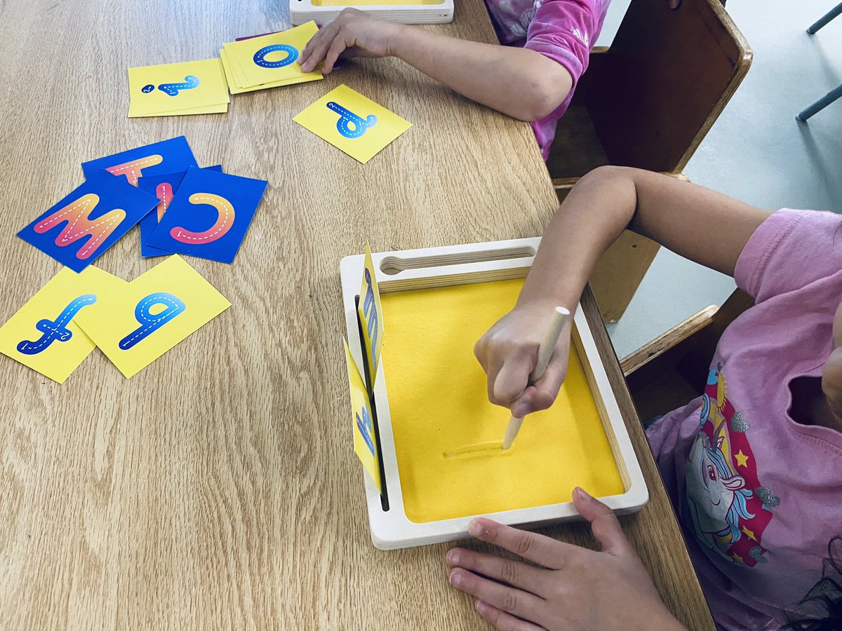 Practicing our letters and sounds in sand!