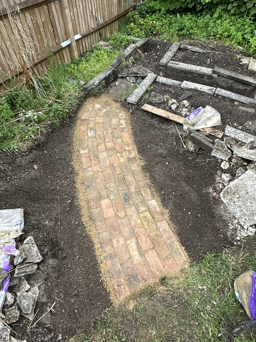 oliverhp's tweet photo. For those interested in my large rubble pile… I smashed it up, dug a trench, filled it up and then used all the bricks I found to top it with this path.

A path that will one day weave between cherry, elder, raspberry and blueberry, taking you into the veg corner 🙂 https://t.co/AG2Pq7Deeh