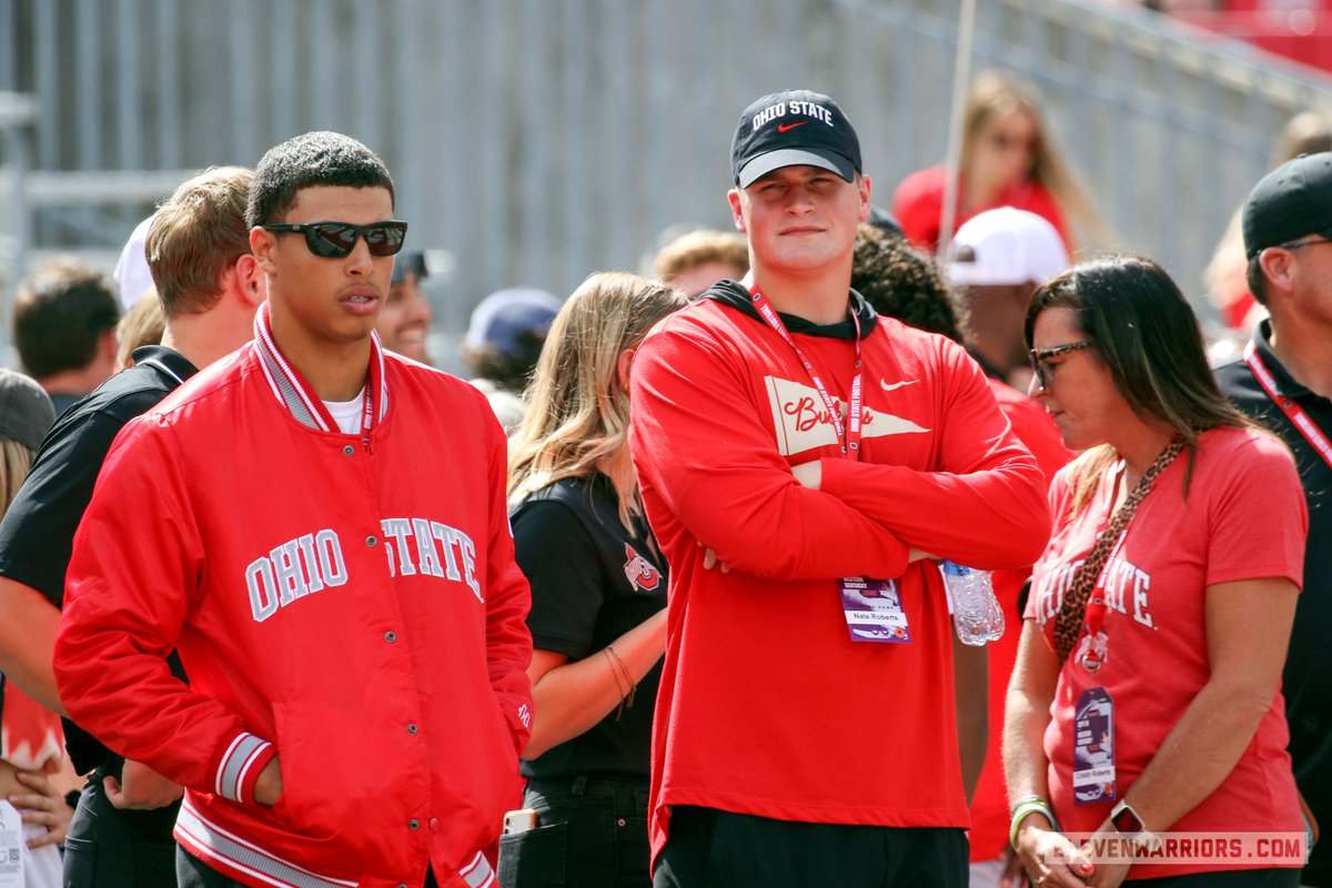 Garrick_Hodge's tweet photo. Ohio State 2025 quarterback commit Tavien St. Clair hanging out with four-star 2025 tight end Nate Roberts during pregame warm-ups. https://t.co/4gkJt0zxy2
