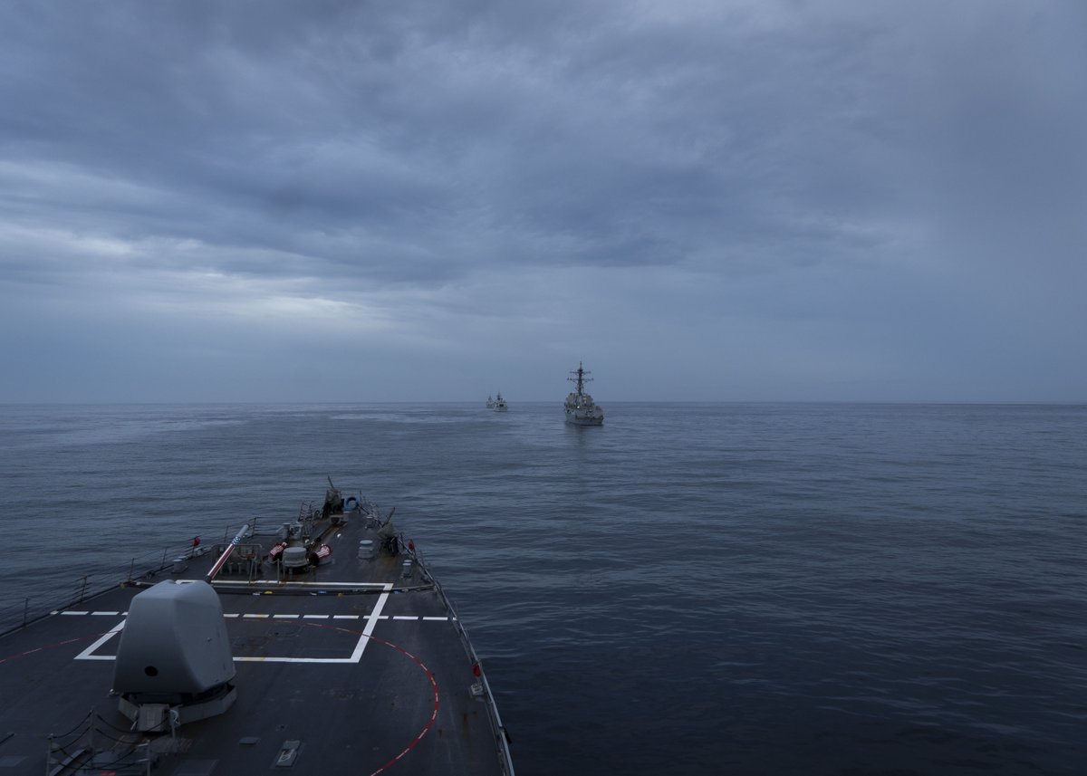 USNavy's tweet photo. Better Together 🤜 🤛 
A Maritime Patrol and Reconnaissance NATO aircraft flies overhead while the Arleigh Burke-class guided-missile destroyer USS Porter (DDG 78) conducts formation steaming during Exercise Cutlass Fury 2023. 
#CutlassFury2023 #CF23 #NavyPartners https://t.co/4AnxiPhCXr