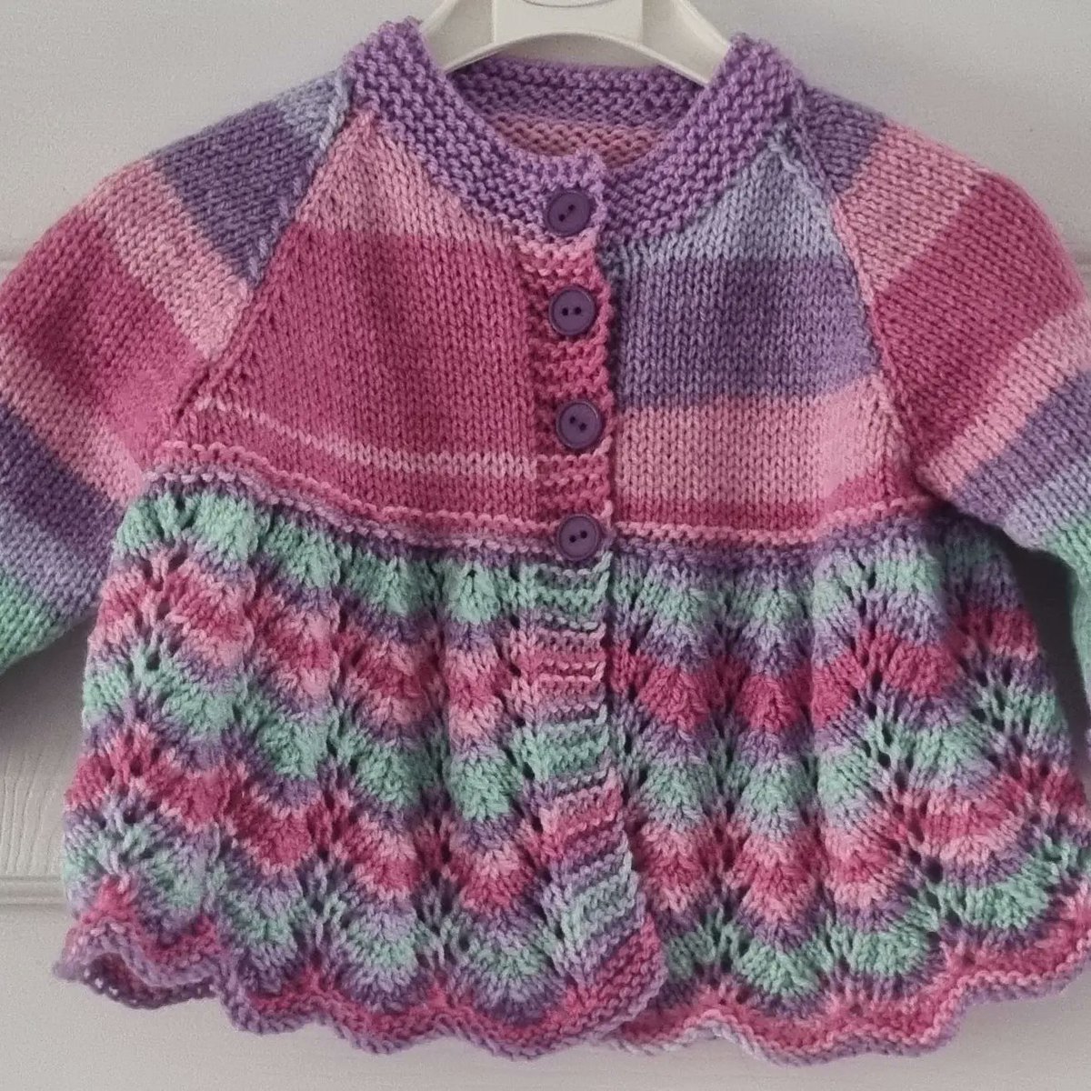 Classic cardigan, different colour scheme, pink and purple #retrobaby #autumnbaby #handmadeuk #folksyseller #babyknitting linktr.ee/poppyknitwear