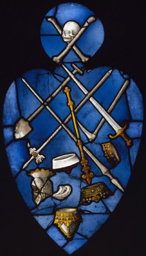 A @V_and_A favourite for #StainedGlassSunday 'Triumph of Death over the Laity' - A coloured glass panel depicting the skull & crossbones triumphant over the falling symbols of the laity (inc. crown, helmet, weapons, cap, tools). From St Herbland in Rouen c.1520-1530 #mementomori