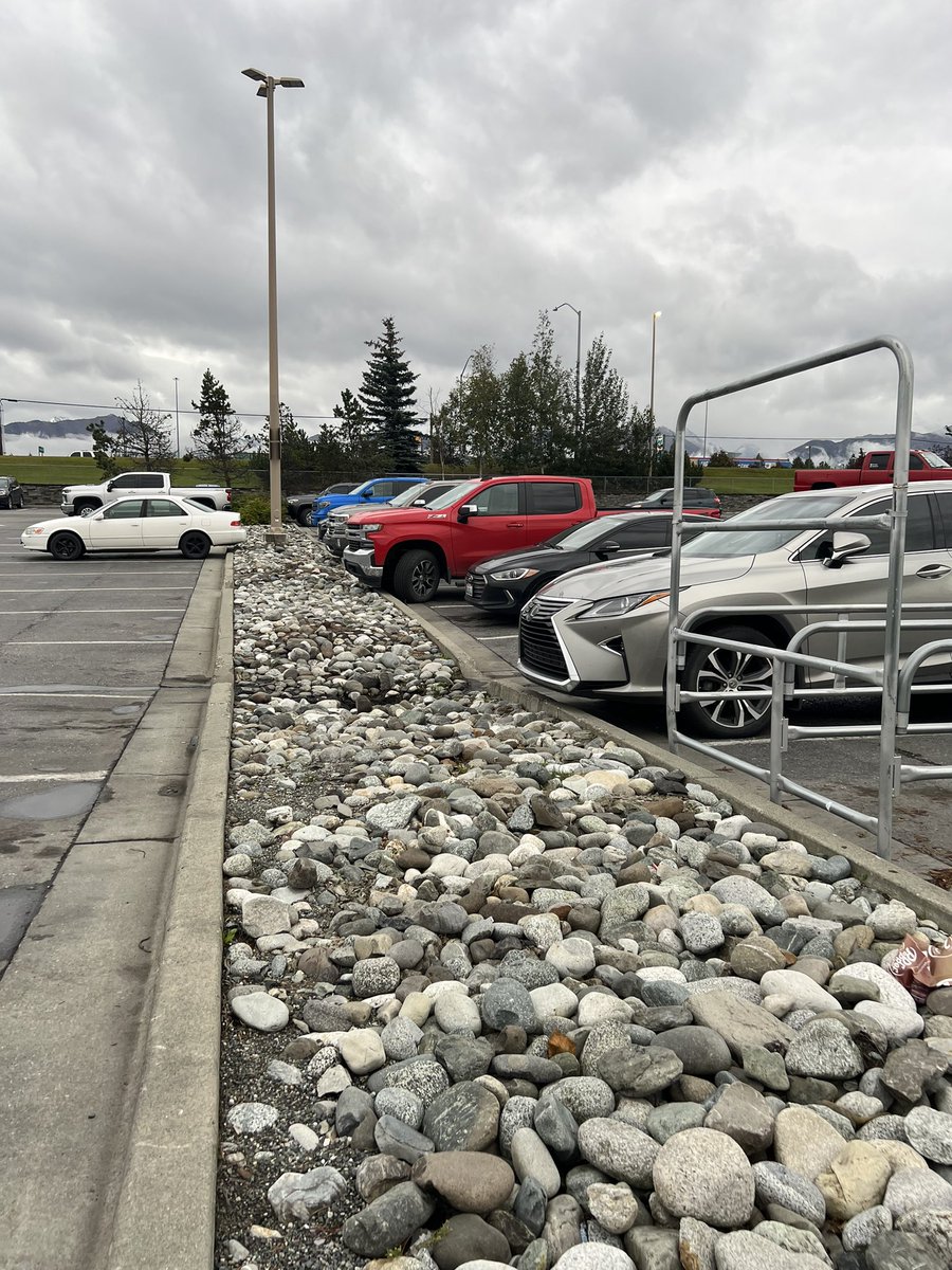 Curious why the parking lot at S. Anchorage Lowes is divided by loose boulders. Not only does it seem hostile to walk across but a liability for personal injury. #pedestriandignity #parkinglothellscapes