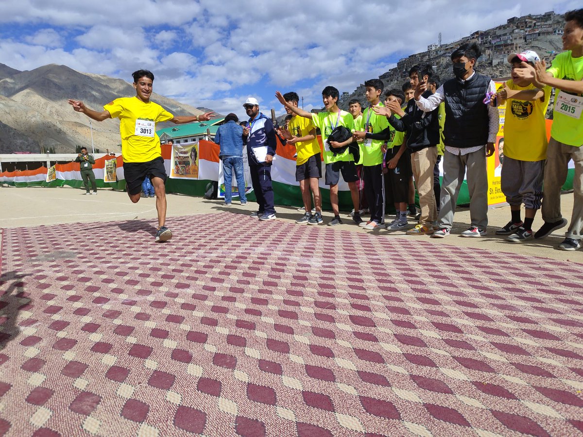 DIPR_Kargil's tweet photo. Day 2: #KargilInternationalMarathon 
Runners in the 3 km boys category cross the finish line at Khree Sultan Choo Sports Stadium Biamathang, Kargil.
#Runforhunderman
@Info_Ladakh https://t.co/tFTfQwCeKp