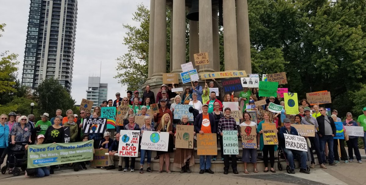 In #Kitchener #Ontario, rally to #EndFossilFuels. We @VOWPeace & @wilpfcanada have our signs 'Peace for #ClimateJustice' and 'Stop the Wars, Stop the Warming,' as #Canada's carbon emissions & military spending keep going up. @morricemike @BardishKW @kwpeace @350Canada @DivestWR